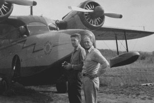 Paul Schaefer, left, prepares to fly over the Adirondacks with State Senator Watson Pomeroy, chairman of the Joint Legislative Committee on Natural Resources c. 1959. Photo courtesy of the Adirondack Research Library of Union College.